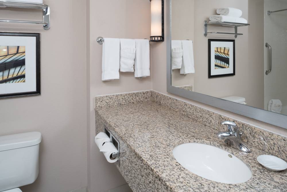 Large bathroom counter tops provide lots of room  