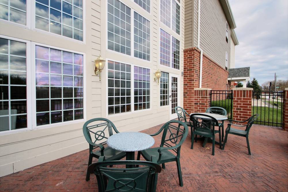 Patio located outside of indoor pool area at hotel