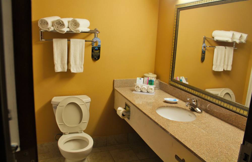 Clean spacious bathrooms with granite & our signat