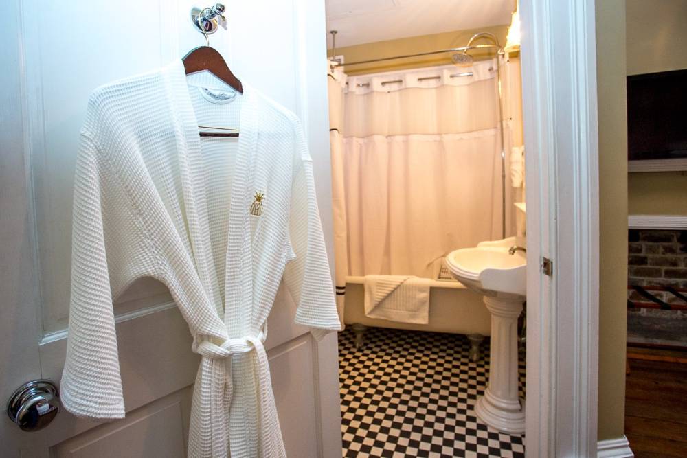 Bathroom with tub at Marshall House Savannah Hotel