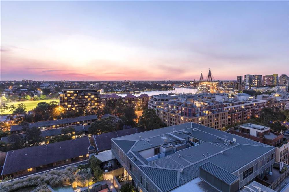 Aerial view over city at sunset