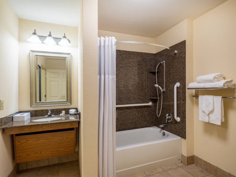 ADA compliant guest room with grab bars and adjust